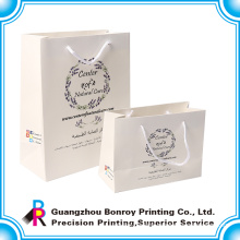 Guangzhou art paper laminated simple low cost paper bag wholesale